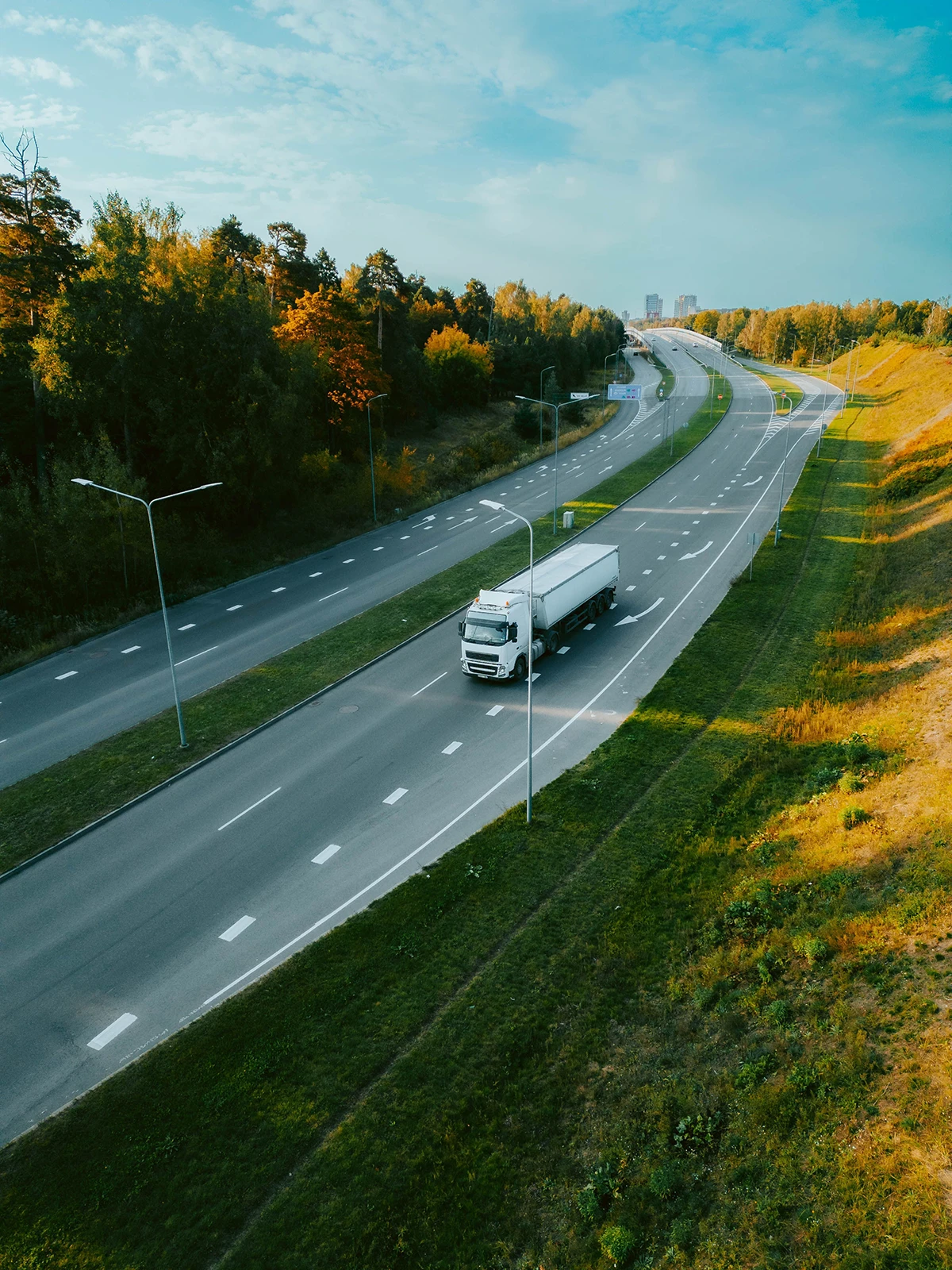 top-view-of-a-truck-driving-along-a-highway-road-i-2023-11-27-05-27-13-utc (1)