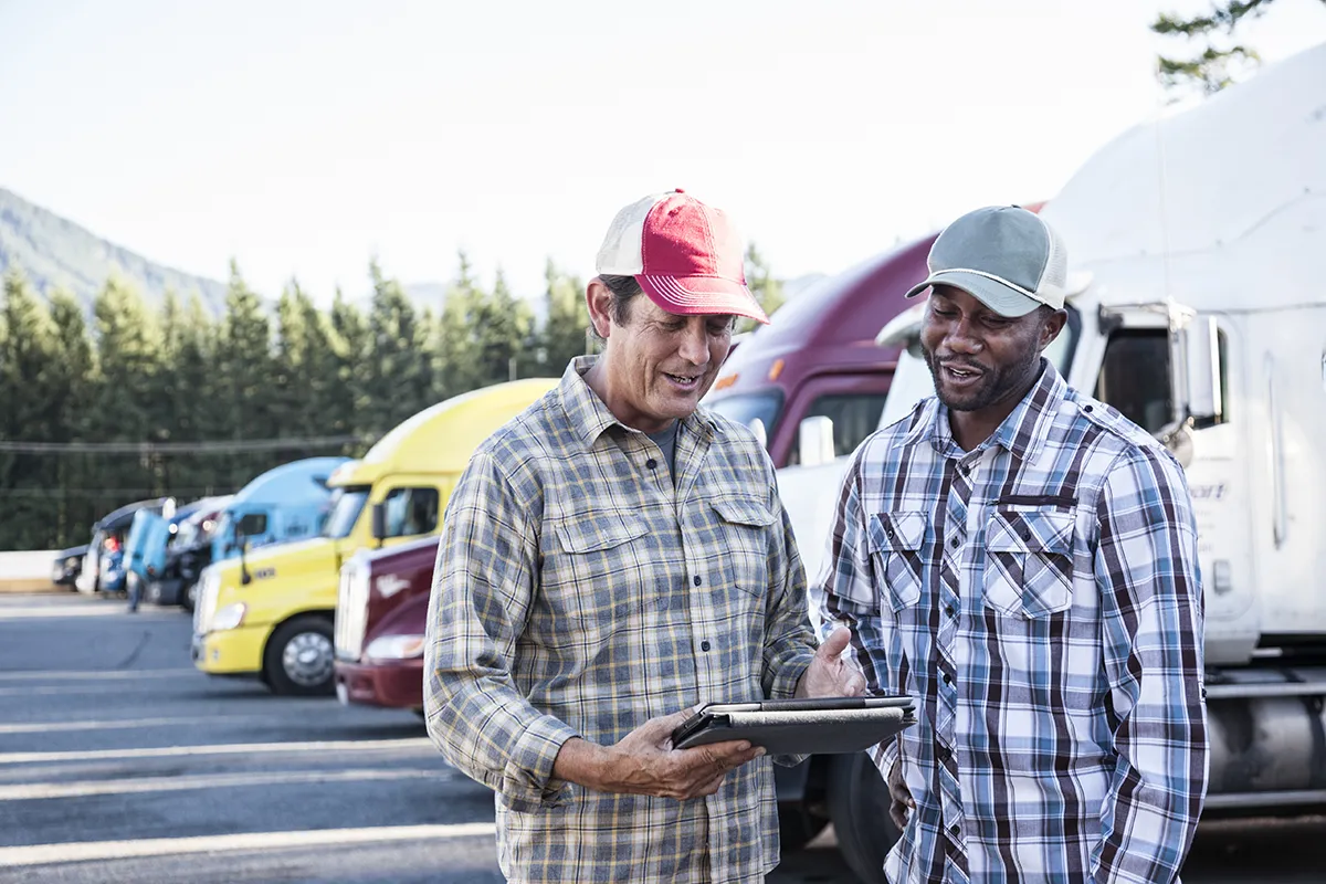 a-caucasian-man-and-a-black-man-truck-driving-team-2023-11-27-05-16-59-utc