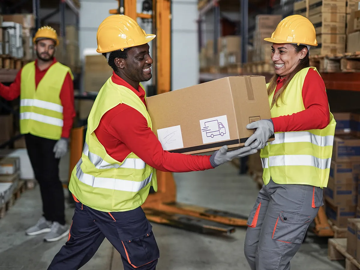 staff-working-in-warehouse-with-protective-wear-2023-11-27-05-23-56-utc